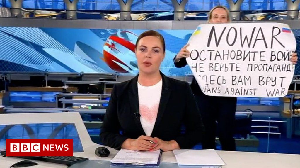 Anti-war demonstrator disrupts Russia’s state TV news